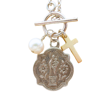 The Our Lady of the Pillar Antique Medal Necklace from Italy features a round silver saint medallion, gold cross charm, and a single white pearl on a sterling silver chain with toggle clasp.