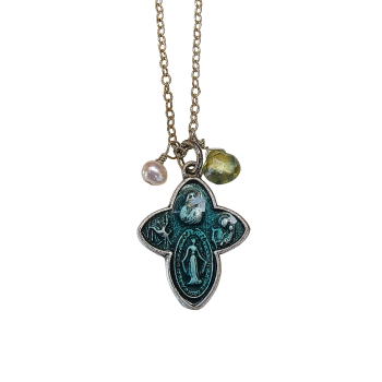 An Antique Four Way Cross Blue Enamel Protection Medal hangs from a sterling silver chain, featuring a small pearl-like bead and a faceted yellow-green gemstone, displayed against a white background.