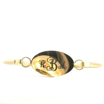 The “Lavender Grace” Druzy Cross Bracelet features a sparkling gold druzy accent and an engraved oval plate with ornate initials, beautifully displayed against a white background.